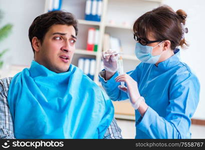 The patient afraid of dentist during doctor visit. Patient afraid of dentist during doctor visit