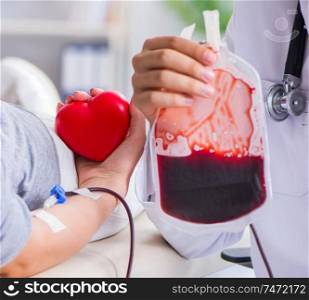 The patient getting blood transfusion in hospital clinic. Patient getting blood transfusion in hospital clinic