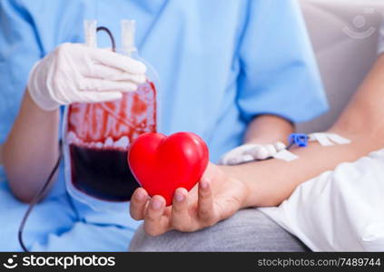 The patient getting blood transfusion in hospital clinic. Patient getting blood transfusion in hospital clinic