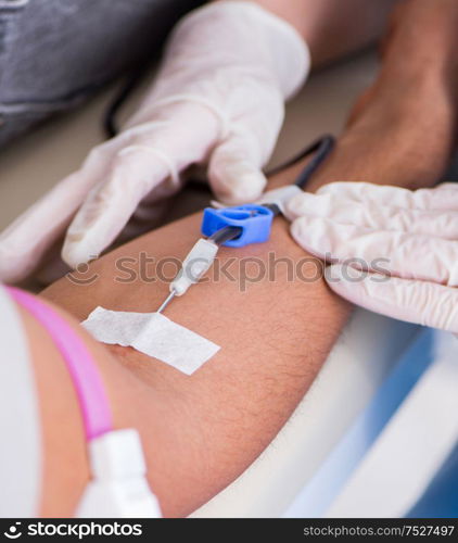 The patient getting blood transfusion in hospital clinic. Patient getting blood transfusion in hospital clinic