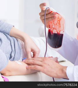 The patient getting blood transfusion in hospital clinic. Patient getting blood transfusion in hospital clinic