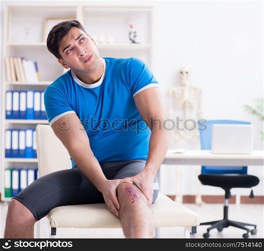 The patient visiting doctor after sustaining sports injury. Patient visiting doctor after sustaining sports injury