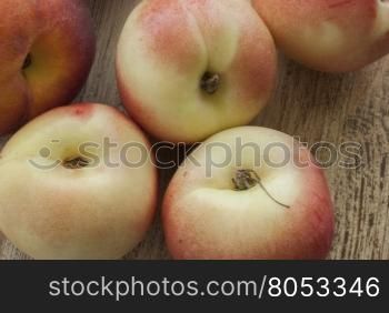 The peaches on the Board. Peaches are an old wooden surface