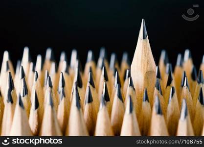 The pencil placed on a black background.