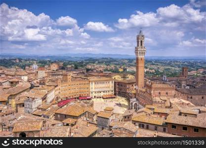 The Piazza del Campo with the Mangia tower in Siena town in the Tuscany region of Italy, Europe.