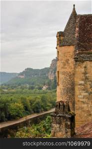The picturesque village of La Roque Gageac backed by the cliff and reflecting in Dordogne river