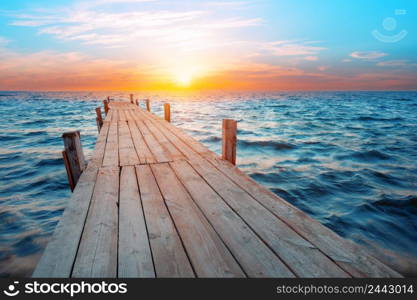 The pier leaving at sea at dawn. Pier leaving at sea at dawn