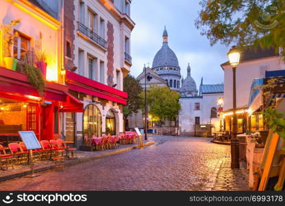 The Place du Tertre with tables of cafe and the Sacre-Coeur in the morning, quarter Montmartre in Paris, France. Montmartre in Paris, France