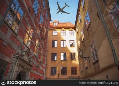 the plane flies over the houses of the city over Stockholm. Sweden.