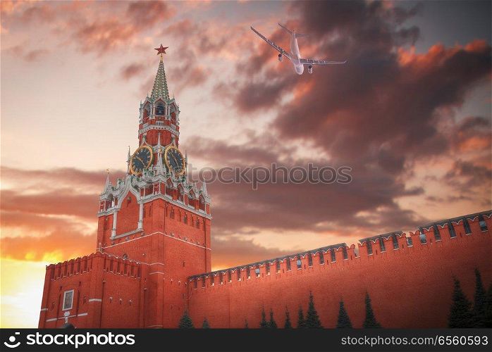 the plane is flying over Kremlin , Moscow