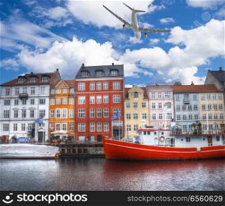 the plane is flying over Nyhavn is the old harbor of Copenhagen. Denmark