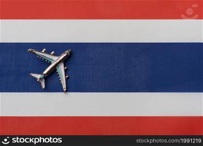 The plane over the flag of Costa Rica, the concept of travel. Toy plane on the flag as a background.. The plane over the flag of Costa Rica, the concept of travel.