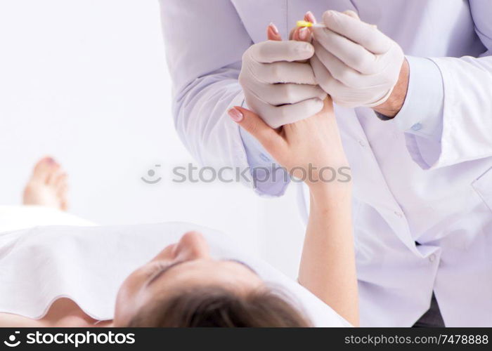 The police coroner examining dead body corpse in morgue. Police coroner examining dead body corpse in morgue