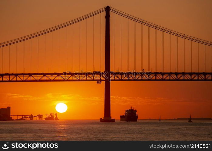 the Ponte 25 de Abril or 25the April Bridge at the Rio Tejo near the City of Lisbon in Portugal. Portugal, Lisbon, October, 2021