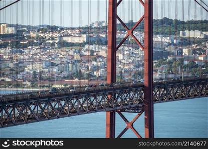 the Ponte 25 de Abril or 25the April Bridge at the Rio Tejo near the City of Lisbon in Portugal. Portugal, Lisbon, October, 2021