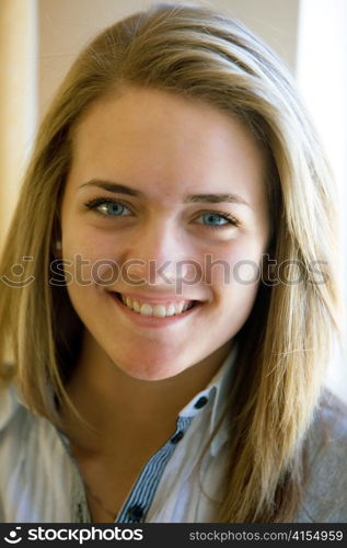 the portrait of a smiling blond woman. fun and joy