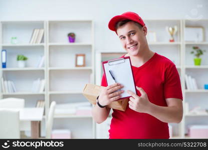 The post man delivering a parcel package. Post man delivering a parcel package