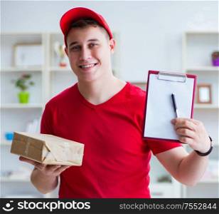 The post man delivering a parcel package. Post man delivering a parcel package