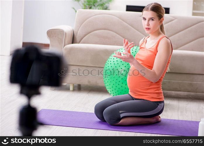 The pregnant woman recording video for blog and vlog. Pregnant woman recording video for blog and vlog