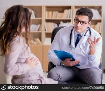 The pregnant woman visiting doctor for consultation. Pregnant woman visiting doctor for consultation