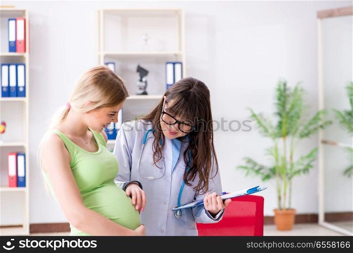The pregnant woman visiting doctor for regular check-up. Pregnant woman visiting doctor for regular check-up