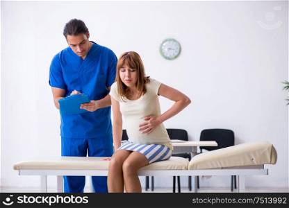 The pregnant woman visiting male doctor gynecologist. Pregnant woman visiting male doctor gynecologist