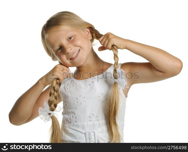 The pretty girl the blonde holding itself for braid. It is isolated on a white background