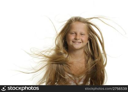 The pretty girl the blonde with flying hair. It is isolated on a white background