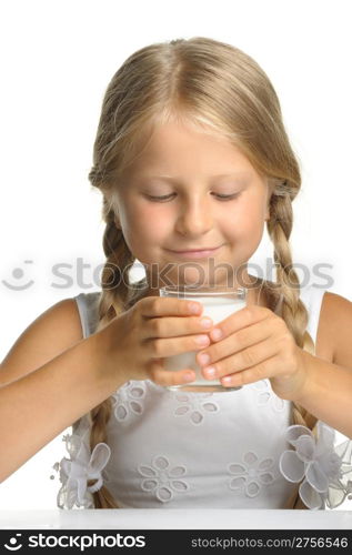 The pretty girl with a glass of milk. It is isolated on a white background