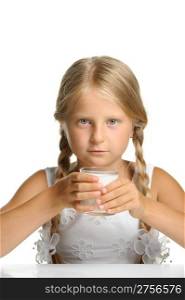 The pretty girl with a glass of milk. It is isolated on a white background