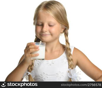 The pretty girl with a glass of milk. It is isolated on a white background