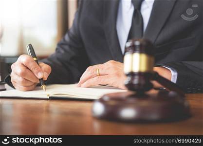 The private office workplace for consultant an young lawyer legislation with gavel and document on wood table