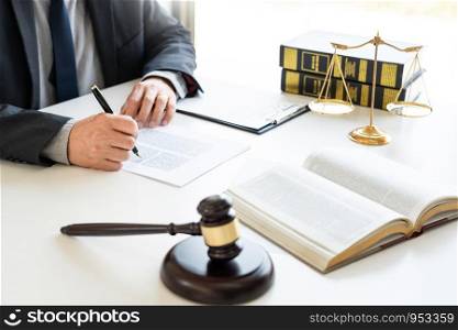 The private office workplace for consultant an young lawyer legislation with gavel and document on wood table, legal justice and judgment concept