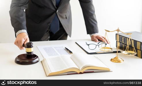 The private office workplace for consultant an young lawyer legislation with gavel and document on wood table, legal justice and judgment concept