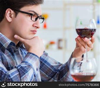 The professional sommelier tasting red wine. Professional sommelier tasting red wine