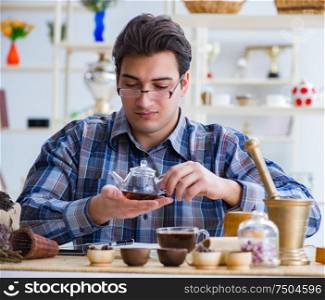 The professional tea expert trying new brews. Professional tea expert trying new brews