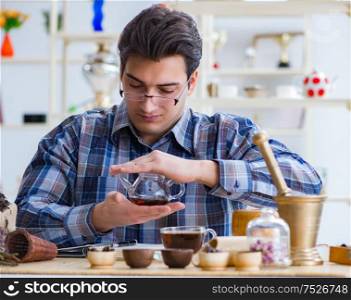 The professional tea expert trying new brews. Professional tea expert trying new brews