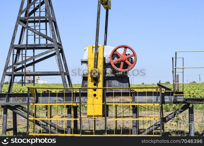 The pumping unit as the oil pump installed on a well. Equipment of oil fields.. Pumping unit as the oil pump installed on a well