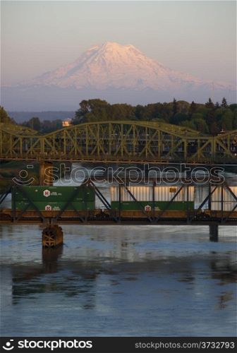 The Puyallup River meanders down from the glaciers on Mount Rainier under bridges through cities on it&rsquo;s way to Puget Sound