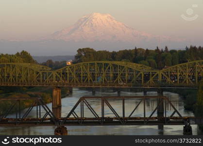 The Puyallup River meanders down from the glaciers on Mount Rainier under bridges through cities on it&rsquo;s way to Puget Sound