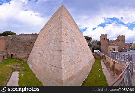 The Pyramid of Cestius and Porta San Paolo in eternal city of Rome view, capital of Italy