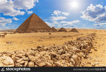 The Pyramid of Menkaure and the rocks in the desert of Giza, Egypt.. The Pyramid of Menkaure and the rocks in the desert of Giza, Egypt