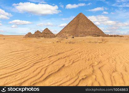 The Pyramid of Menkaure and the small pyramids in the beautiful desert of Giza, Egypt.. The Pyramid of Menkaure and the small pyramids in the beautiful desert of Giza, Egypt