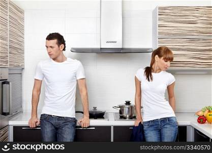 The quarrelled man and the woman on kitchen