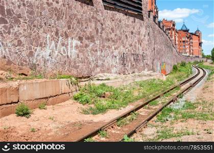 The rails of the railway and the facade of the building in the city of Orenburg