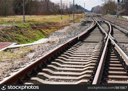 the railway goes into the distance, the rails in several rows. the rails in several rows, the railway goes into the distance