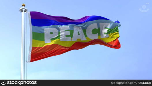 the rainbow flag of peace flying in the wind. No war movement