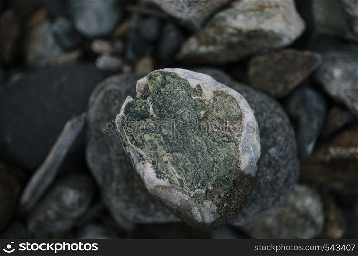 The rapid flow of a mountain river with stones close up. The rapid flow of a mountain river with stones