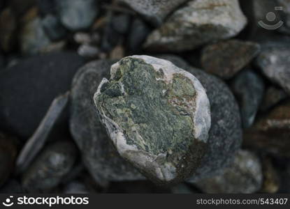 The rapid flow of a mountain river with stones close up. The rapid flow of a mountain river with stones