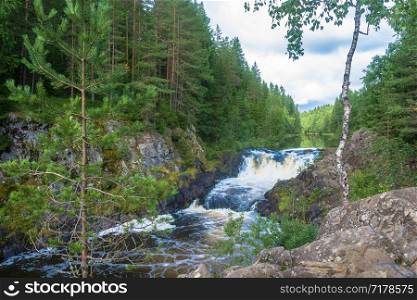 The rapid Kivach waterfall on a summer day, Karelia, Russia.